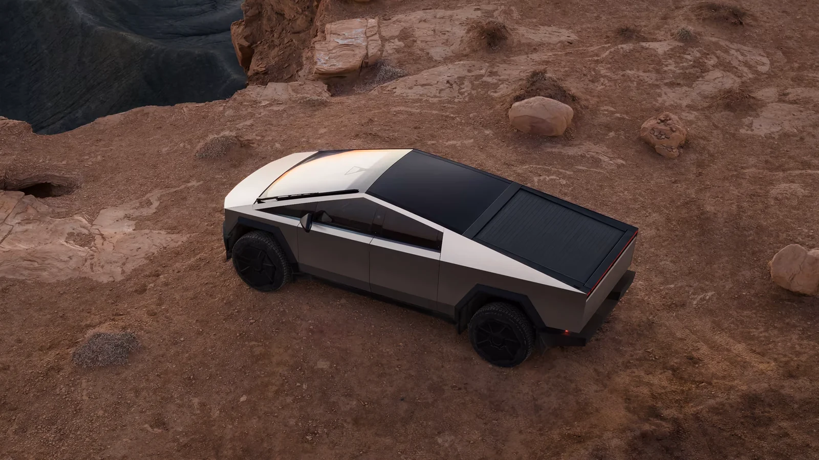 Cybertruck da Tesla, alvo do limpador a laser da Tesla, em terreno arenoso